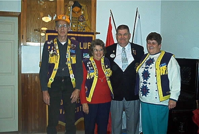 District Governor Earl Einarson presenting Lion Royce Vaughan - 400 Visitation Pin, President Florence Vaughan - 200 Visitation Pin and Lion Wendy Blue - 50 Visitation Pin