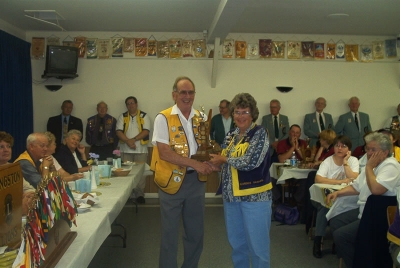 Lion Florence accepting Best Club Runner Up Trophy from PDG Harry Currie