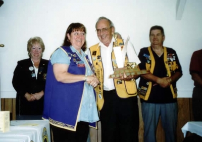 President Dallas Moore accepting Best Club Runner-Up Trophy District 41N2 2003-2004 from PDG Harry Currie