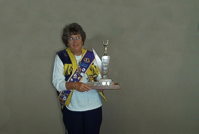 Past President Florence Vaughan displays the BEST RUNNER-UP TROPHY District 41N2 2002-2003