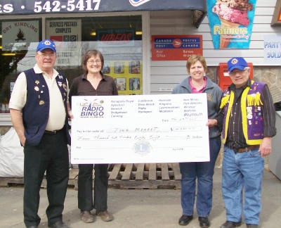 Lion Allan & Lion Bucky with Joyce Cann from Cann's Convience on left presenting Bingo cheque to Tina Merrett on right.