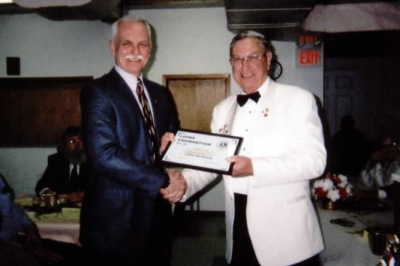 DG Ray Penny presenting Lion Duncan MacIsaac with Life Membership Lions Foundation District 41N2