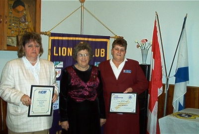 President Florence Vaughan presenting LCIF Honor Roll Certificate to Lion Dallas Moore and Lions Foundation District 41N2 LIfe Member Certificate to Lion Wendy Blue.