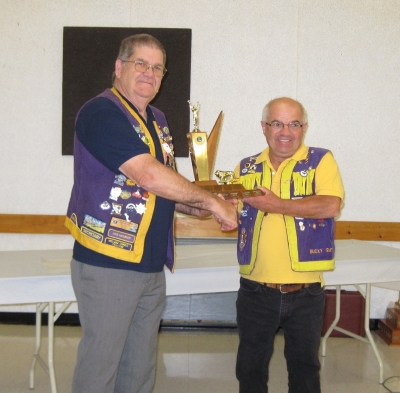Lion Bucky accepting Best Runner-Up Club Trophy 2010-2011 District N2 from PDG Earl Einarson
