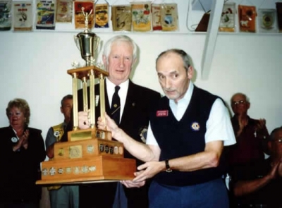 Lion Ken MacKenzie accepting Outstanding Lion of Year Trophy District 41N2 2003-2004 from PDG Art MacKenzie