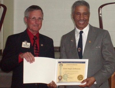 PID Jim Sherry presenting Lion Angus Johnson with International Presidents Certificate Appreciation