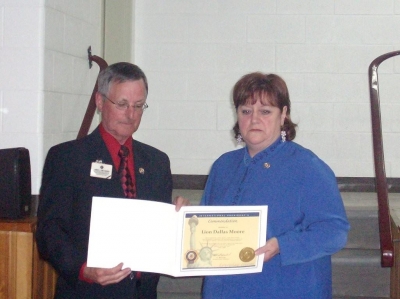 PID Jim Sherry presenting Lion Dallas Moore with International Presidents Certificate Appreciation