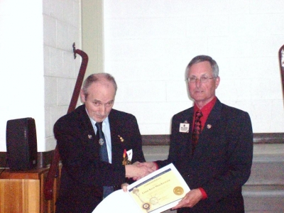 PID Jim Sherry presenting Lion Ken MacKenzie with International Presidents Certificate Appreciation