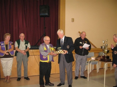 Past President Bucky Smith accepting the PDG Art MacKenzie Best Web Site Trophy District N2 2007-2008 from PDG Art MacKenzie